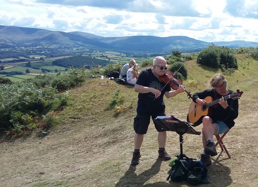 Jo and Dave playing at a Mind Charity event near the Brecon Beacons, July 2019
